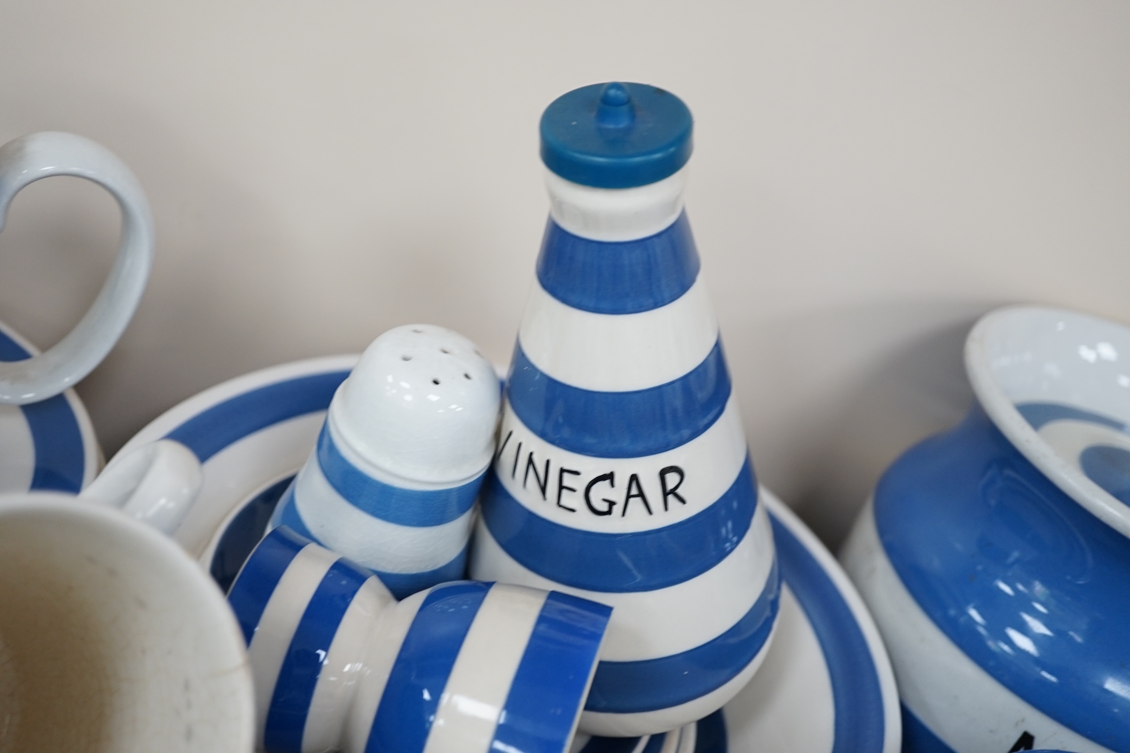 A quantity of unmarked and non T.G.Green blue and white Cornishware to include a Mincemeat jar and cover, egg cups, bowls, dishes and sifters, approximately eighty pieces. Condition - fair to good